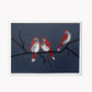 Painting of three birds with red and white plumage perched on a branch against a dark blue background. By Mitch Ferrin.