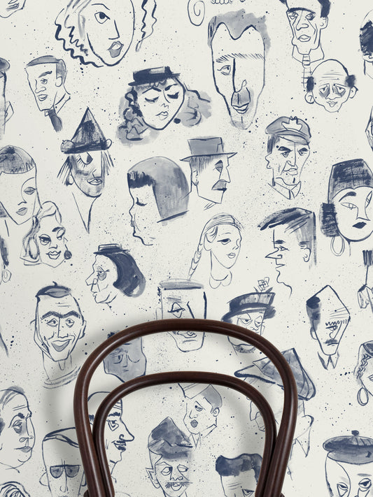 A repeat pattern of hand-drawn caricature faces in dark blue ink on a warm off-white textured background.