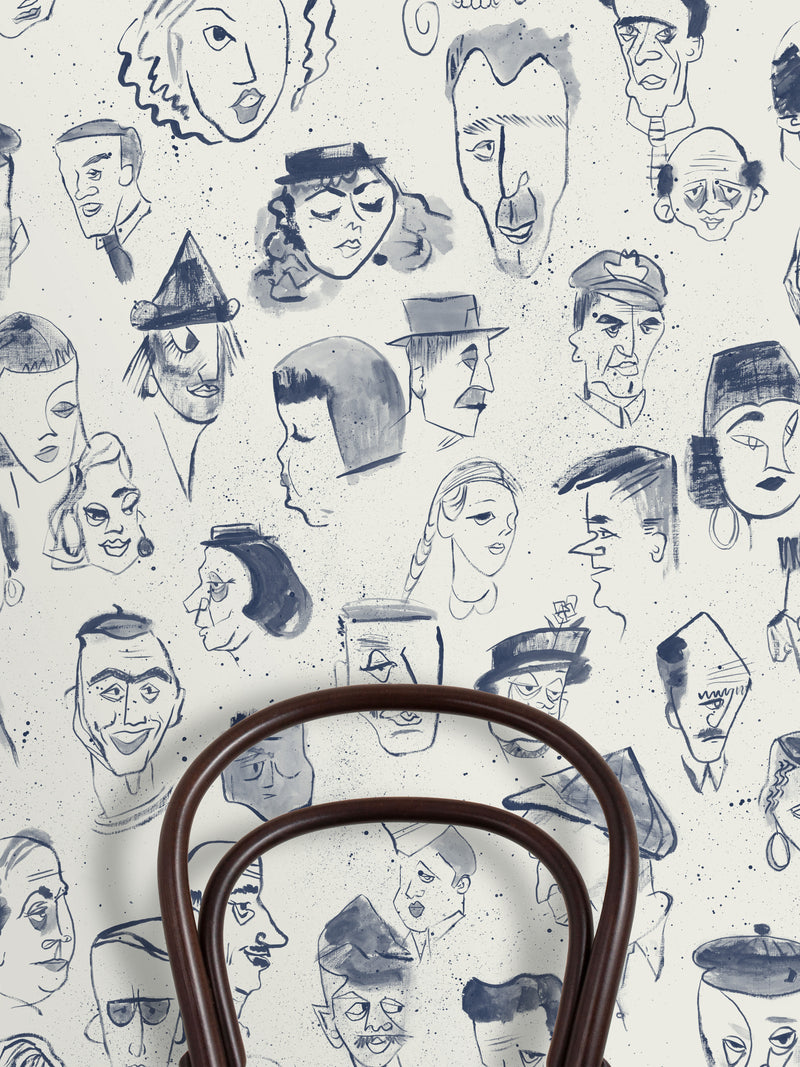 A repeat pattern of hand-drawn caricature faces in dark blue ink on a warm off-white textured background.