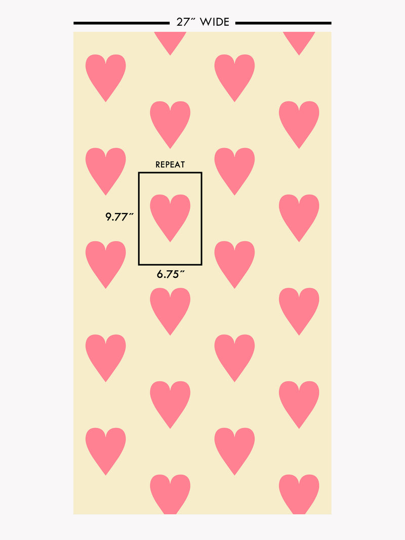 Hand screen printed wallpaper featuring pink hearts on a pale yellow background.